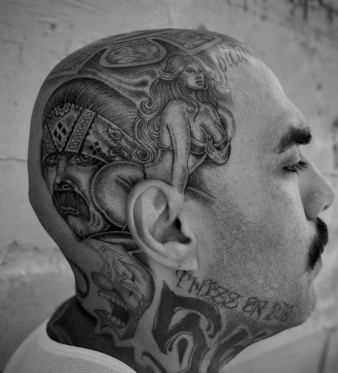 Black and grey fine line head tattoo